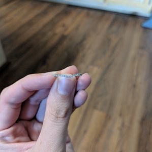 Contoured wedding band size 5 from Jared. Real diamonds.  Round and 2 baguettes.